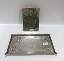 A Glasgow School white metal tray, of rectangular form, decorated in relief with Celtic knotwork,