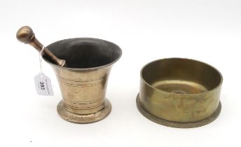 A heavy brass mortar and pestle, 18th/19th century, together with a large "Trench Art" bowl,
