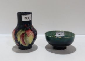 A Moorcroft Leaf and Berry pattern vase together with a Freesia pattern dish Condition Report: