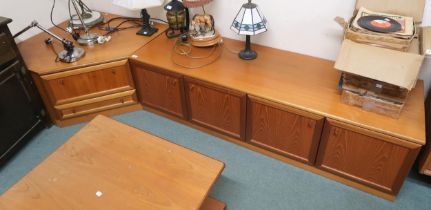 A mid 20th century teak veneered media unit, 48cm high x 265cm wide x 93cm deep Condition Report: