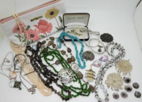 A collection of silver jewellery to include a marcasite peacock brooch, pagoda brooch, celtic knot
