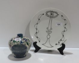 A Jean Cocteau for Limoges plate together with a lady artist painted jar, signed A.C. Stewart