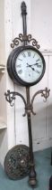 A 20th century free standing architectural style double sided garden clock, 173cm high Condition