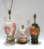 Two Moorcroft Magnolia lamps, and another in Hibiscus pattern Condition Report:Available upon