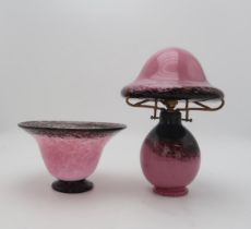 A Monart style glass table lamp, the bulbous base with mushroom shaped shade, in mottled pink with