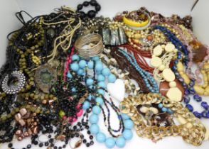 A large collection of vintage costume jewellery to include, a retro ceramic pendant, signed
