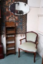 A lot comprising 20th century oak five shelf open bookcase, open armchair and an oval frameless wall