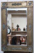 A late Victorian brass framed bevelled glass wall mirror, 84cm high x 55cm wide Condition Report: