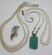 A silver mounted marcasite and moulded glass peacock necklace, two strings of faux pearls with