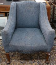 A 20th century blue floral upholstered armchair with cabriole supports, 88cm long x 76cm wide x 71cm