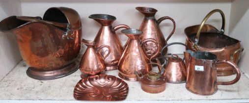 A mixed lot to include two assorted copper and brass coal buckets, five assorted copper jugs, two