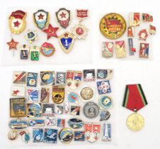 Soviet memorabilia: a collection of enamel pins, comprising 10 political examples, 35 space