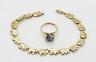 A 9ct gold, blue gem ring, size K, and a 9ct gold elephant bracelet, weight together 7.6gms