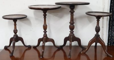 A lot of four assorted 20th century mahogany circular topped tripod wine tables (4) Condition