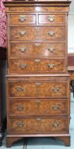 A 20th century mahogany and burr walnut veneered chest on chest with moulded cornice over two