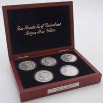 Five Decade Set of Uncirculated Morgan Silver Dollars with Morgan Silver dollars from 1879, 1889,