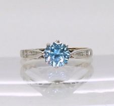A 9ct gold and platinum set blue zircon solitaire ring, size M, weight 2.1gms Condition Report: