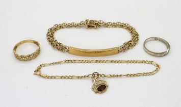 a collection of 9ct gold to include an id bracelet, with fancy chain link strap, two rings and a