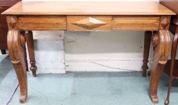 A late Victorian oak console table with rectangular top over single drawer on carved serpentine