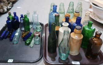 A collection of glass and stoneware bottles including Deeks Chemist Shanklin, Mew Langton & Co