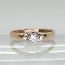 A 9ct rose, yellow and white gold diamond solitaire set with an estimated approx 0.15ct old cut