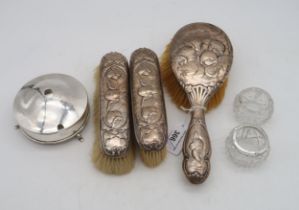 A collection of silver including a three piece silver dressing set, by William Comyns, London,