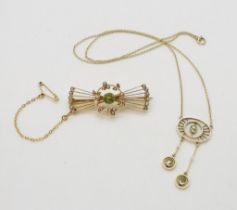 A 15ct gold peridot and pearl brooch, weight 5.2gms, together with a yellow metal green gem &