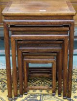 A 20th century Chinese hardwood nest of four tables with rectangular tops over shaped aprons on