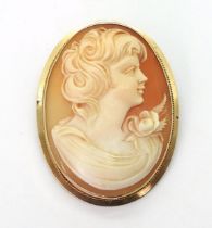 A large shell cameo, in a 14k pendant brooch mount, dimensions 5cm x 3.8cm, weight 9.2gms