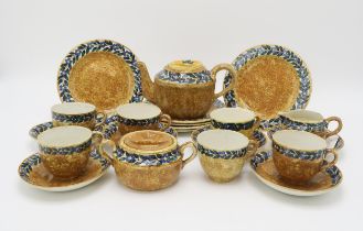 A Mary A Ramsay for Strathyre teaset the mottled brown ground with blue and yellow flowers and