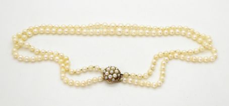 A double string of cultured pearls with a 9ct gold pearl set clasp, length of shorted strand 46cm,