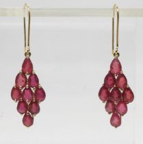 A pair of 9ct gold ruby drop earrings, length 4.3cm, weight 3.8gms Condition Report:The rubies are