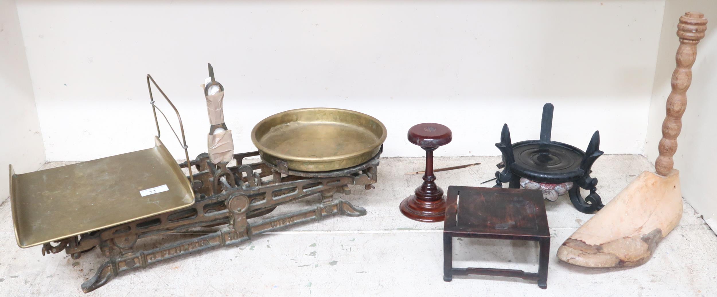 A late 19th century cast iron and brass J Florenz Wein scales, a pine shoe last and three assorted