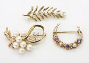 A 9ct pearl and diamond brooch, a 9ct pearl fern brooch and a further brooch set with amethyst and