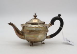 A small silver teapot, Birmingham 1906, of circular form, with a shaped inverted rim, 209gms