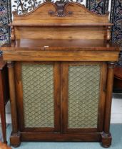 A Victorian rosewood chiffonier with carved scrolled superstructure over pair of brass mesh front