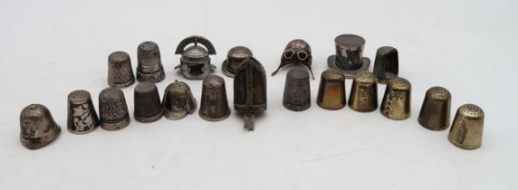 A collection of silver and white metal thimbles, including novelty examples modelled as a bowler