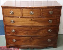 A Victorian mahogany and satinwood inlaid bow front chest of drawers with three short over three
