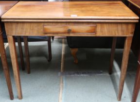 A Victorian mahogany fold-over card table with rectangular top concealing baize lined play surface