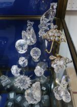 A small collection of Swarovski crystal including a seated Cheetah, assorted other animals and birds