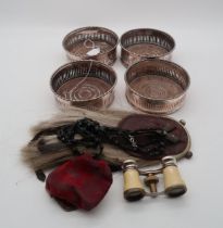 A collection of EPNS including four wine bottle coasters, a sporran, a pair of opera glasses, and