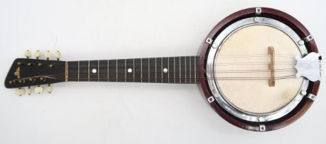A banjo mandolin 17 frets and marked British Made to the headstock with original case and a tin of