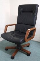 A contemporary black vinyl upholstered swivel desk chair, 109cm high x 68cm wide x 84cm deep