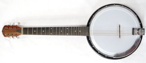 An Eko six string guitar banjo, gitjo banjitar, stamped made in Italy to the headstock with a soft