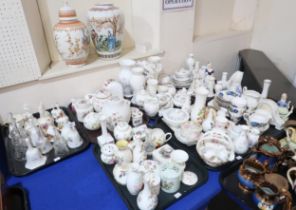 A large quantity of ceramics including Wedgwood, Aynsley and others comprising bells, vases, trinket