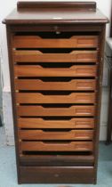 An early 20th century tambour front filing cabinet, tambour front concealing nine internal
