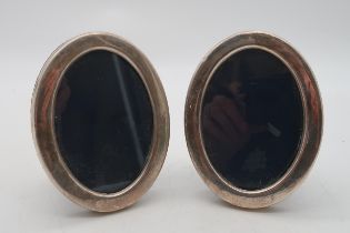 A pair of silver photo frames, by Mappin & Webb, Sheffield, of oval form 11 x 8.5cm (2) Condition