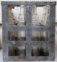 A 20th century galvanised crate containing seven moulded glass Esso lube one quart bottles