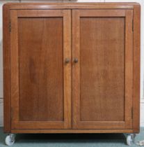 A 20th century oak two door side cabinet, 69cm high x 66cm wide x 41cm deep Condition Report: