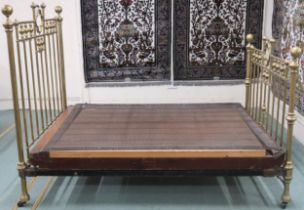 A Victorian brass bed frame with quatrefoil decoration to head and foot boards, 155cm high x 206cm